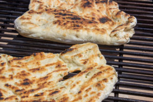 "Grilling Naan" by Let's Cook That licensed under CC NC ND 4.0 Easter